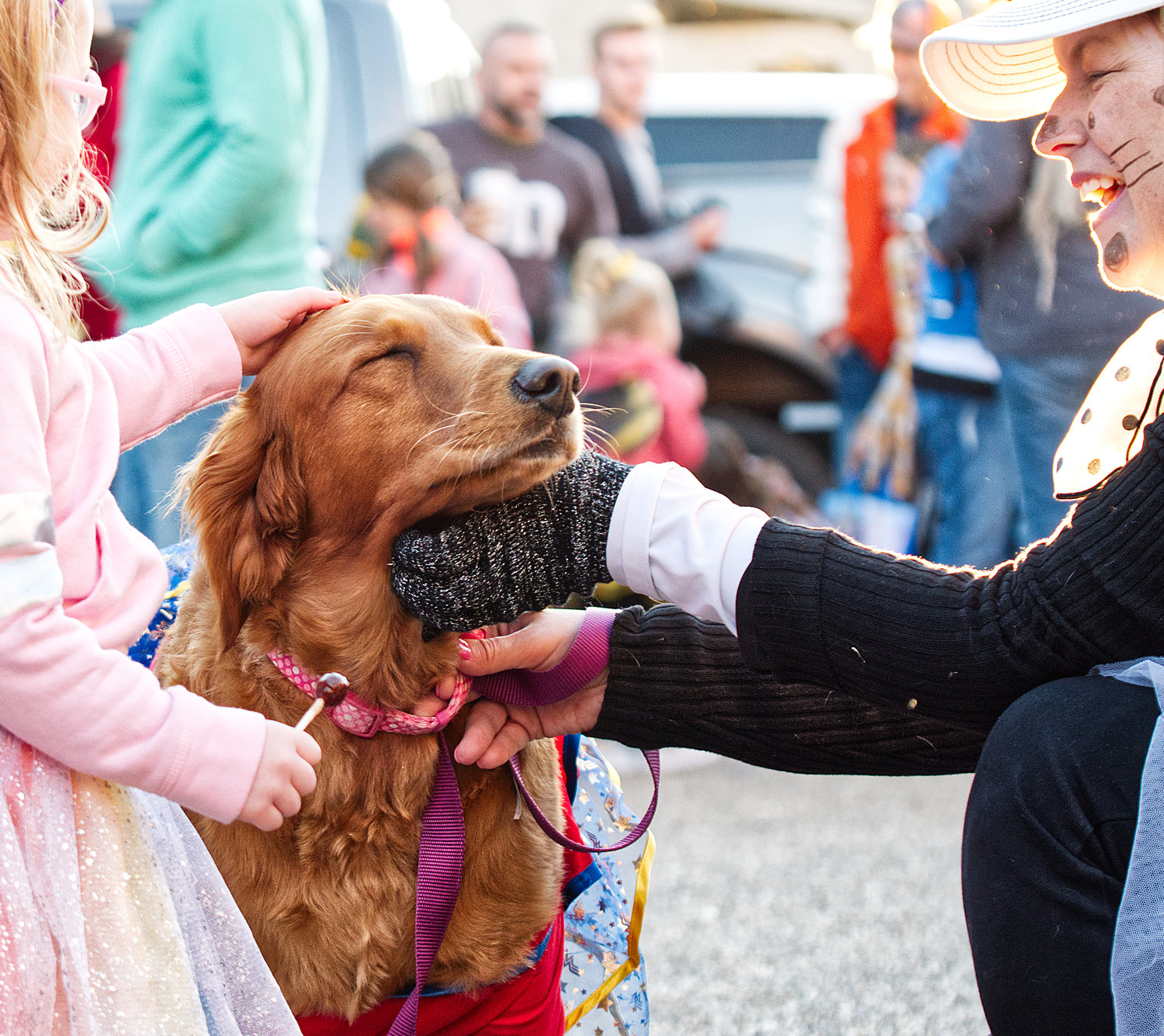 Jamie Johnson (r) and dog Maxi at trunk or treat in downtown Mineola.